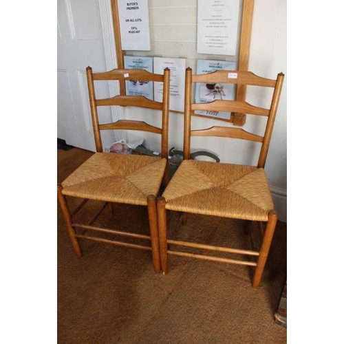 330 - A pair of 20th century Clissett design triple rung ladderback chairs with woven rush seats, 89cm hig... 