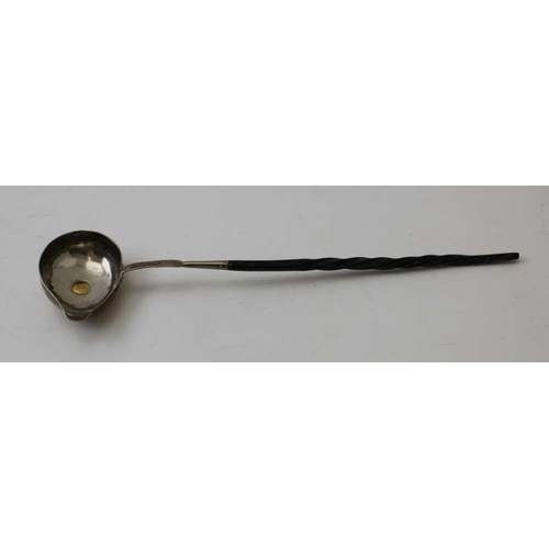 36 - A George III silver ladle, with pouring lip, inset gold coin, dated 1786, fitted twisted whale bone ... 