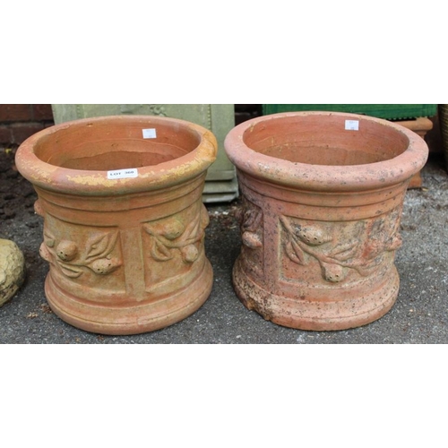 360 - A pair of small ornate terracotta plant pots