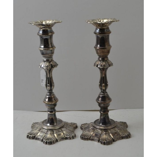 4 - Garrard & Co. Ltd. A pair of Georgian design silver candlesticks, with removable sconces, on petal f... 