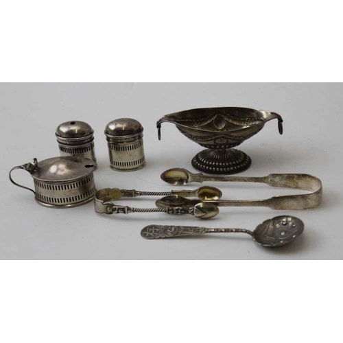 52 - A collection of assorted hallmarked silver includes two pairs of sugar tongs a Chinese spoon and a l... 