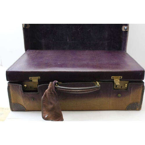 62 - An Edwardian Finnigan's of New Bond St. London & Manchester, purple leather vanity case, partly fitt... 