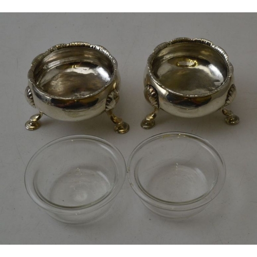 68 - A pair of silver George II salts, raised upon three, scallop knee pad supports, London 1753, engrave... 