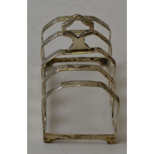 83 - Adolf Scott, an Art Deco design silver toast rack, Sheffield 1931, 7.5cm x 4.5cm, 49g