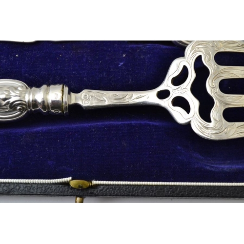 85 - Aaron Hadfield, a mid 19th century silver pair of fish servers, with engraved decoration, Sheffield ... 