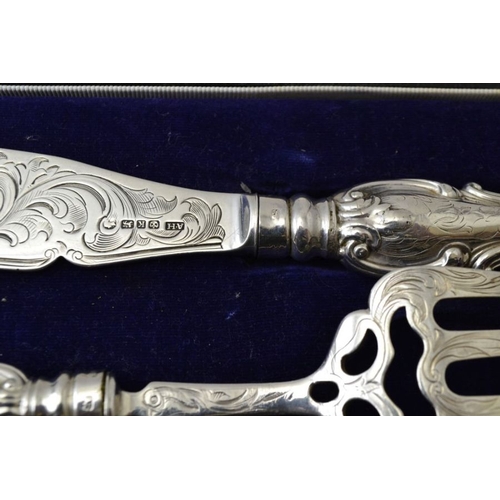 85 - Aaron Hadfield, a mid 19th century silver pair of fish servers, with engraved decoration, Sheffield ... 