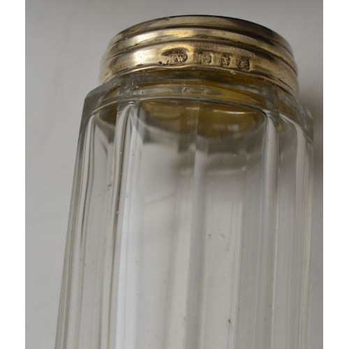 87 - A collection of silver mounted glass dressing table jars, various hallmarks