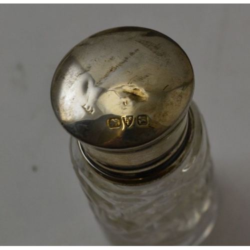 87 - A collection of silver mounted glass dressing table jars, various hallmarks