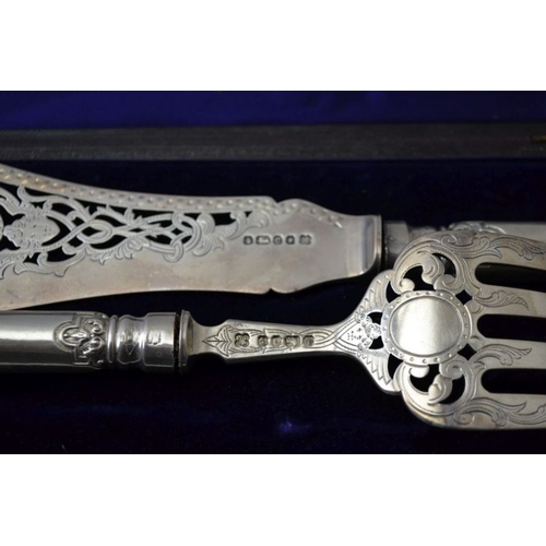 9 - Martin Hall and Co, a silver bladed fish serving knife and fork, decoratively pierced and embossed, ... 