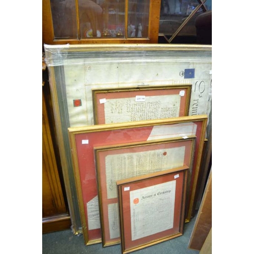 119 - Six framed and glazed indentures and other legal documents