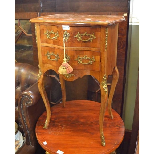 124 - A French mahogany two drawer side table with decorative cast metal appliques