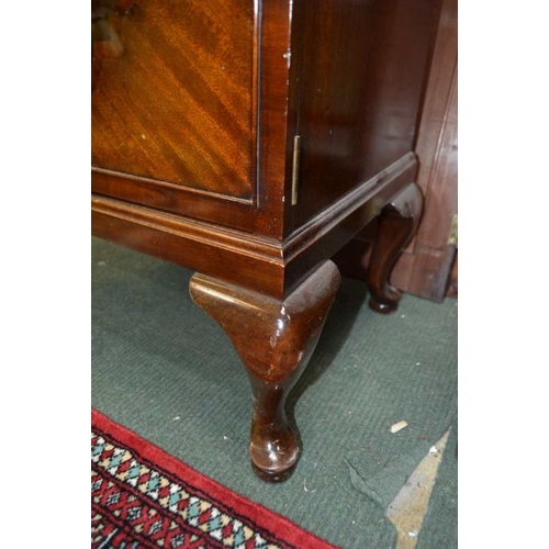 136 - A 20th century Waring & Gillow mahogany two door music cabinet, on short cabriole legs