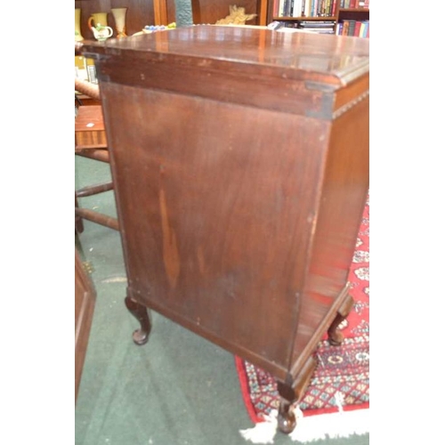 136 - A 20th century Waring & Gillow mahogany two door music cabinet, on short cabriole legs