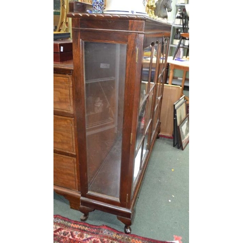 140 - A mahogany finished glazed display cabinet on short cabriole legs