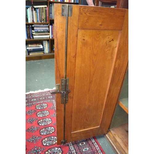 142 - A late 19th / early 20th century solid oak silver cabinet, with well fitted interior & a substantial... 