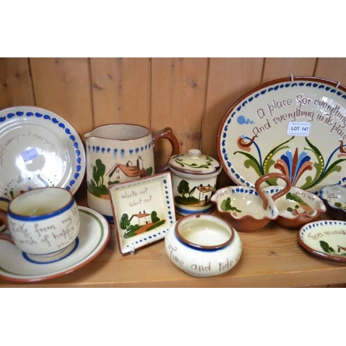 147 - A large selection of Torquay Pottery Motto ware