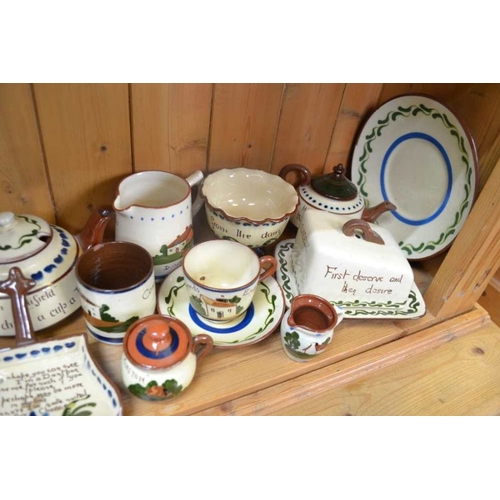 147 - A large selection of Torquay Pottery Motto ware