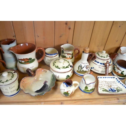 147 - A large selection of Torquay Pottery Motto ware