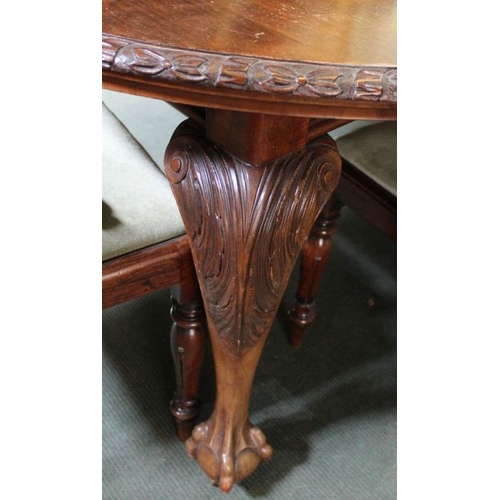 172 - First quarter 20th century mahogany wind out dining table on carved cabriole legs with ball and claw... 