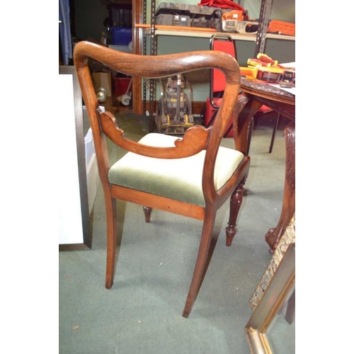 173 - A set of four Regency rosewood dining chairs carved and shaped back, inverted tulip fore legs drop i... 