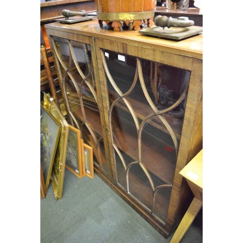 179 - A glazed front bookcase