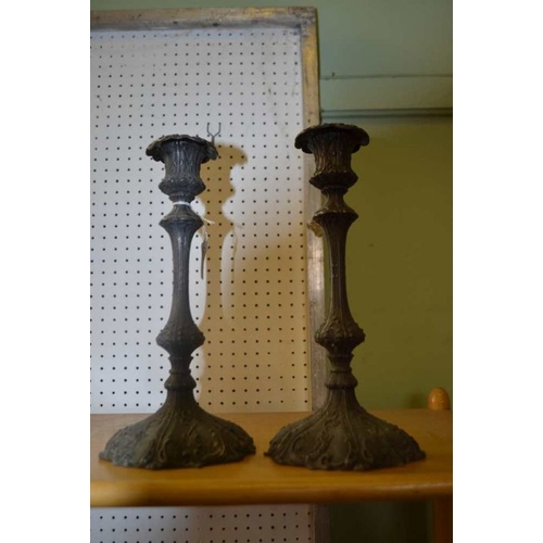 253 - A pair of 19th century metal candlesticks