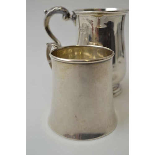 261 - Josiah Williams & Co. A silver flared body tankard, London 1939, together with a baluster form silve... 