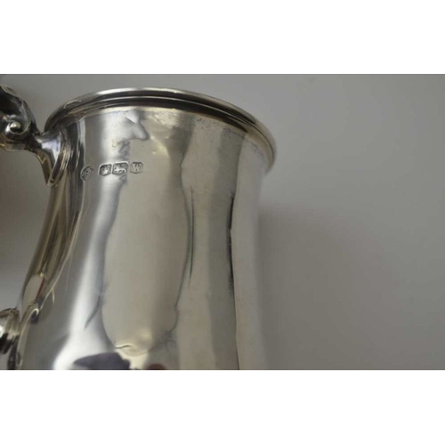 261 - Josiah Williams & Co. A silver flared body tankard, London 1939, together with a baluster form silve... 