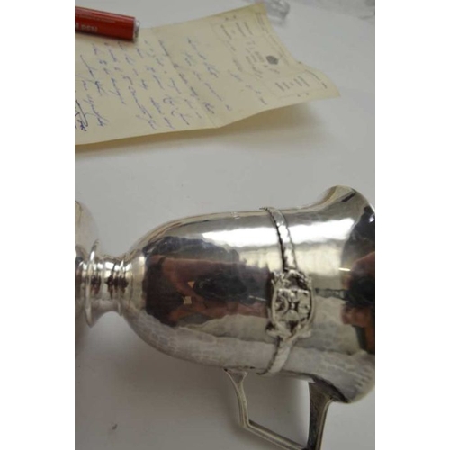 265 - Albert Edward Jones, An Arts & Crafts silver Christening mug, planished body, banded with a rope twi... 