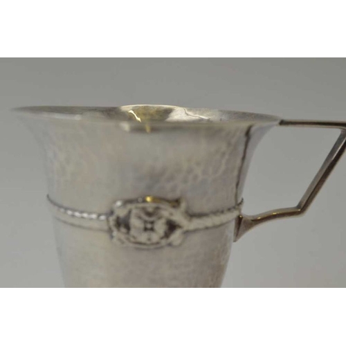 265 - Albert Edward Jones, An Arts & Crafts silver Christening mug, planished body, banded with a rope twi... 