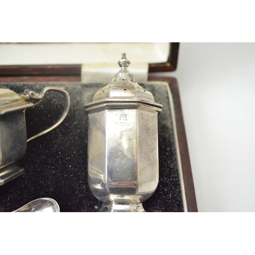 268 - William Neale & Son Ltd. A cased silver condiment set, the pieces of octagonal form, comprising; two... 