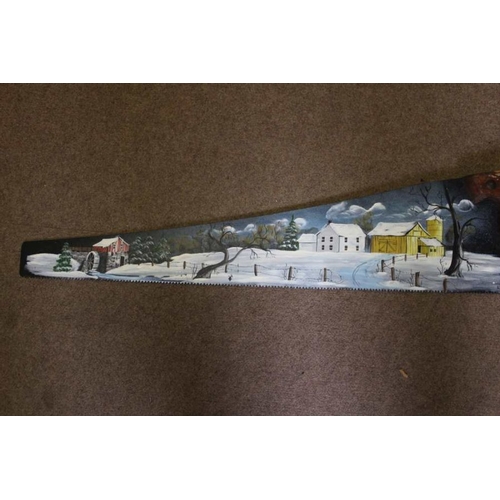 279 - Two hand painted Amish saws, both with a farm landscape, one in winter and one in summer, both signe... 