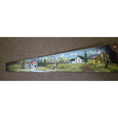 279 - Two hand painted Amish saws, both with a farm landscape, one in winter and one in summer, both signe... 