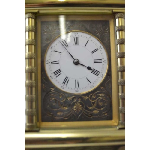 280 - A late 19th century repeating carriage clock, brass case, the circular white enamel dial, with Roman... 