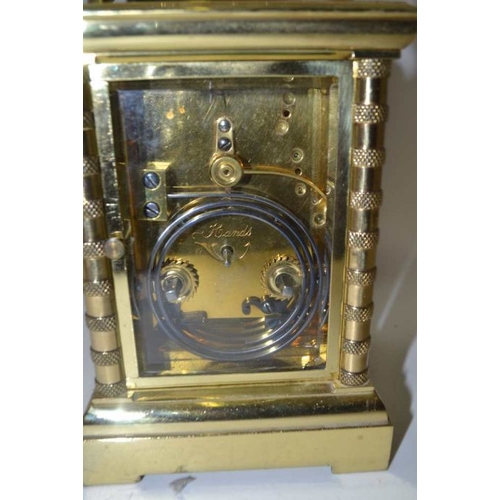 280 - A late 19th century repeating carriage clock, brass case, the circular white enamel dial, with Roman... 