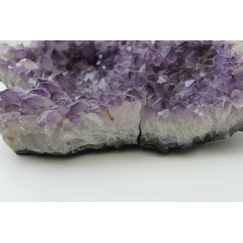 293 - A large amethyst geode, 32cm x 22cm