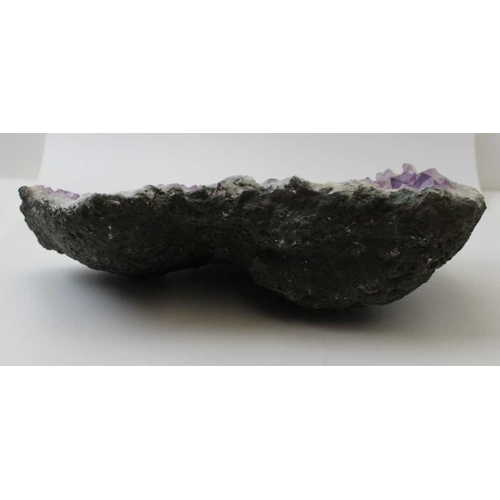 293 - A large amethyst geode, 32cm x 22cm