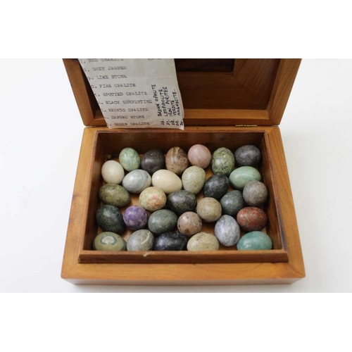 298 - A thuja burr aromatic wood box containing ovoid stone samples to include; rose quartz, jade stone, e... 