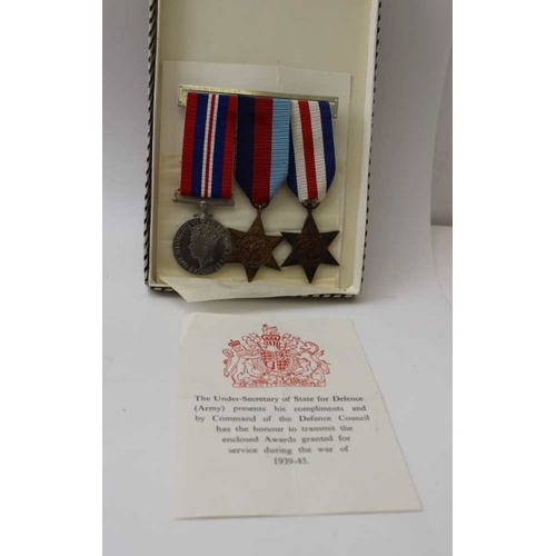 300 - A collection of miscellaneous items includes; WWII medals, carved stone animals, cast & panted lead ... 