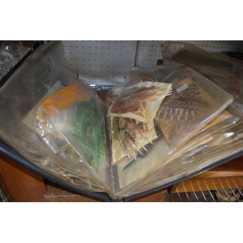 31 - Four assorted wooden fly and tackle boxes with contents, an unhooking net and a file of fly feathers