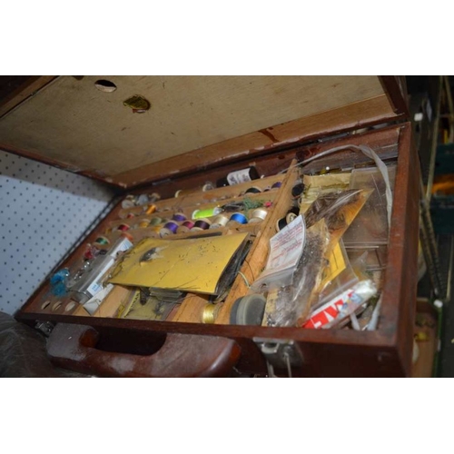 31 - Four assorted wooden fly and tackle boxes with contents, an unhooking net and a file of fly feathers