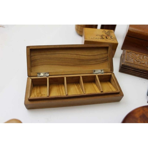 379 - A collection of Treen, includes lidded boxes, money box, turned vases etc