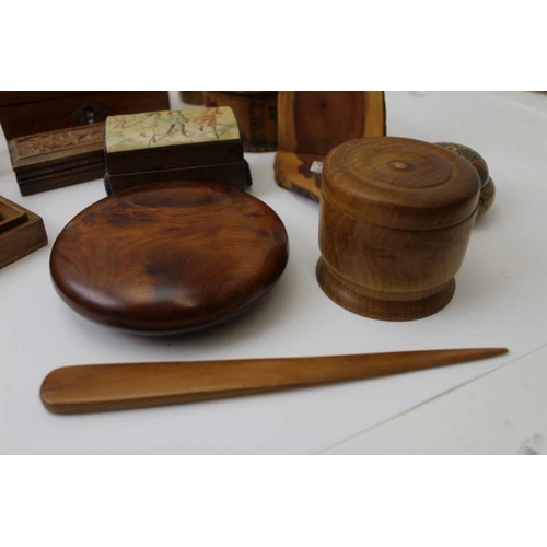 379 - A collection of Treen, includes lidded boxes, money box, turned vases etc