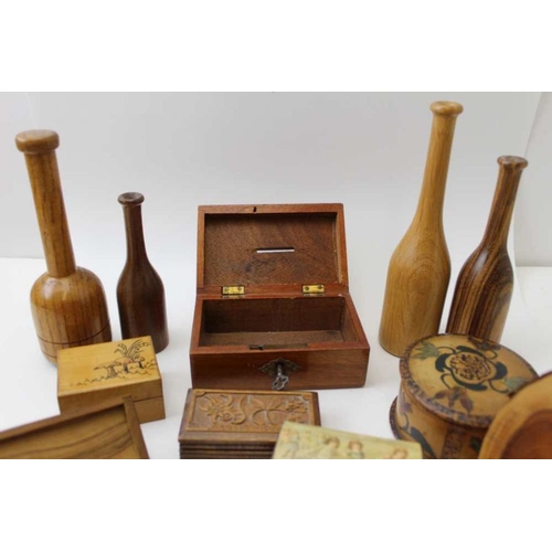 379 - A collection of Treen, includes lidded boxes, money box, turned vases etc