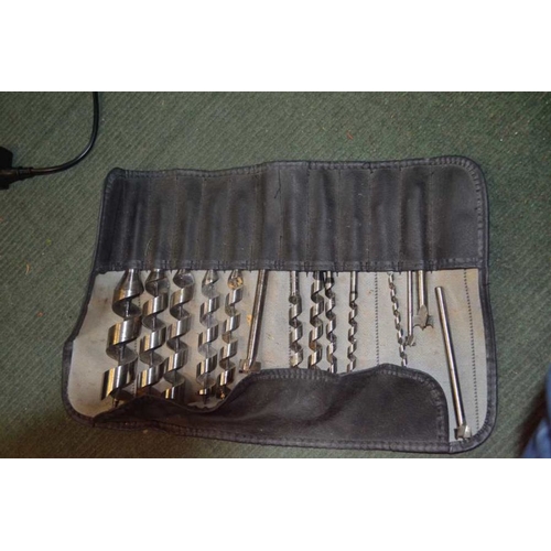 95 - A Stanley tool roll containing chisels with a toll roll of bits etc (SOLD AS SEEN)