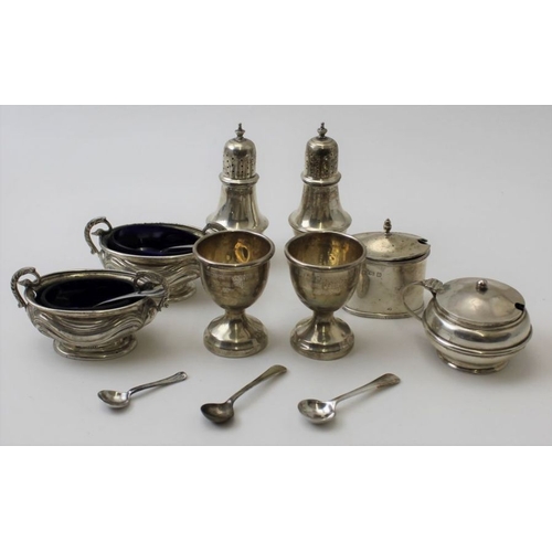 Stokes and Ireland Ltd, a pair of Georgian design silver pepper pots ...