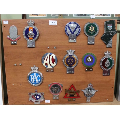 21 - A presentation board of mounted metal motor club badges, Bugatti Owners amongst various others