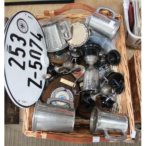 71 - A wicker basket containing a selection of motoring tankards and trophies