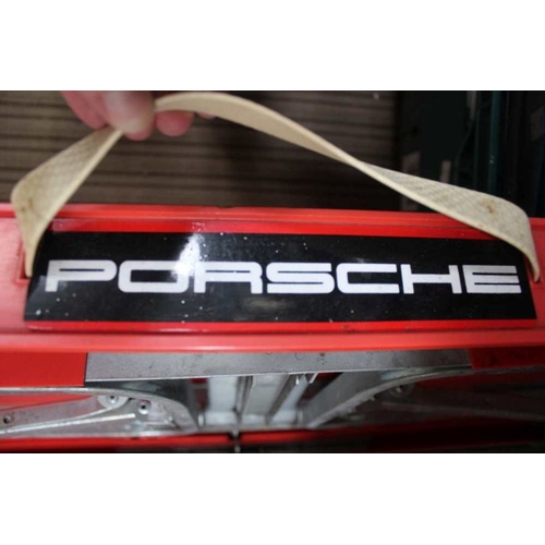 76 - A Porsche branded vehicle stand in carry case