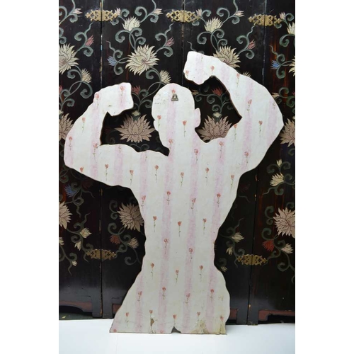 23 - A cut out silhouette of Muhammad Ali, his fists in the air as a sign of victory, covered in imitatio... 